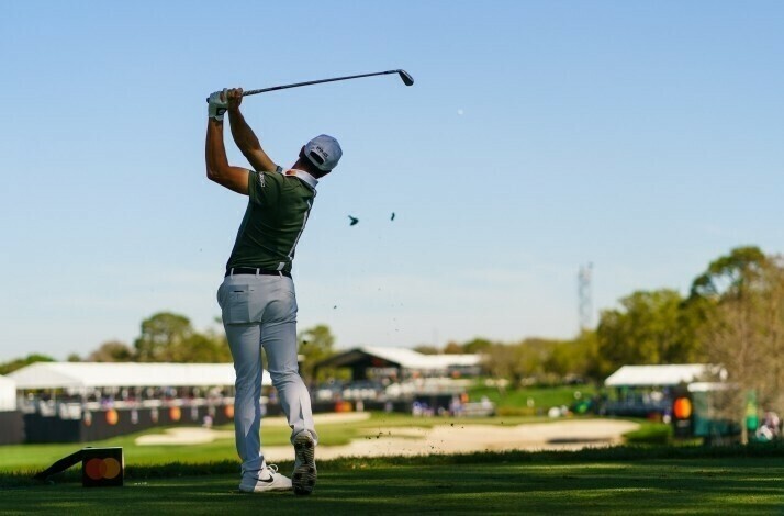 A man playing golf at a PGA field