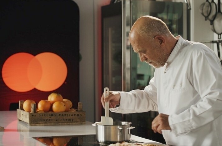 Chef Stelios Parliaros during his video masterclass of using pantry supplies to make delicious desserts. Mastercard logo at the backend.