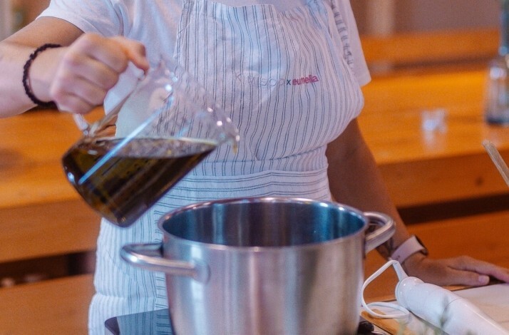 Ingredients being poured into a pot.