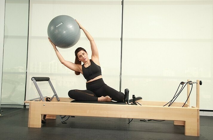 The celebrated fitness expert Yasmin Karachiwala showing exercises during workout session.