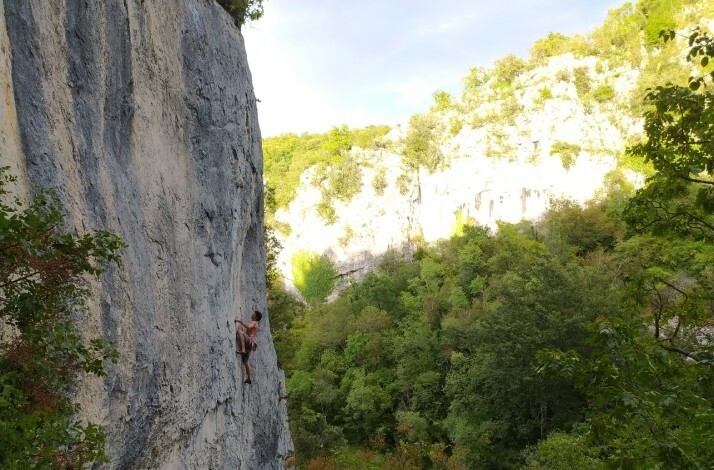 A participant climbing a mountain with special equipment and belay, bird eye view