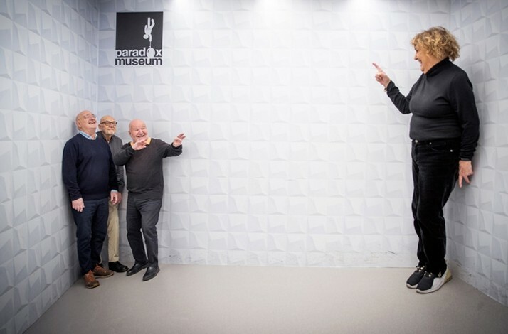 Exhibition room at Paradox Museum Stockholm where an optical illusion is created of a person looking shorter or taller depending where he stands in the room.