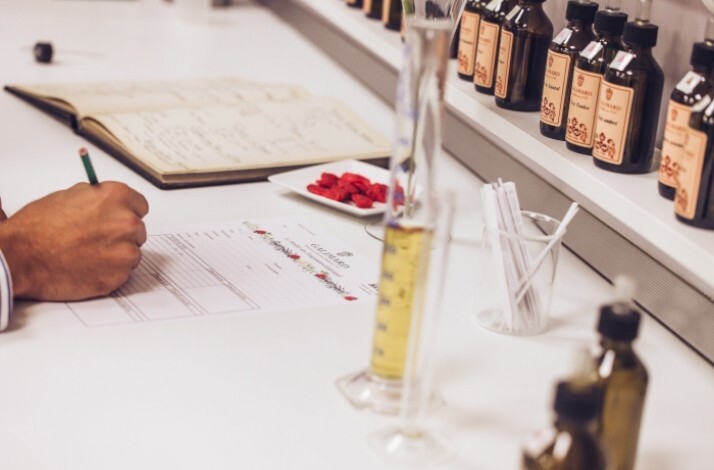 White tabletop with various equipment used in perfume making, Studio des Fragrances Galimard, Grasse, France.